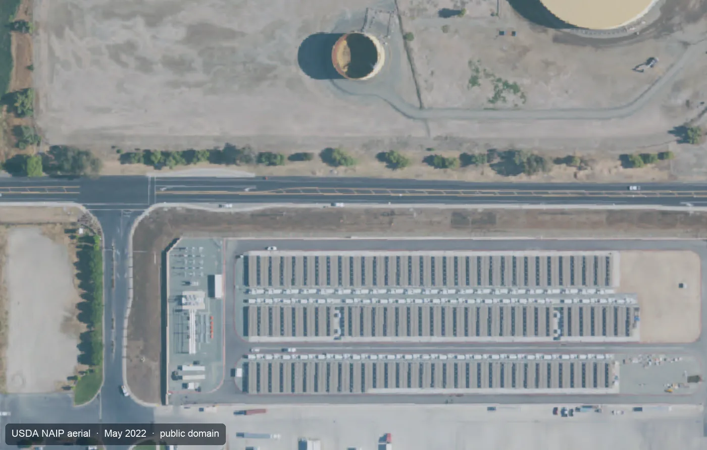 Aerial view of Diablo Energy Storage in Pittsburg, California, rows of utility-scale battery enclosures